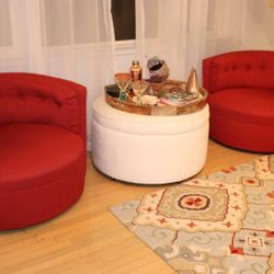 Red chairs and ottoman