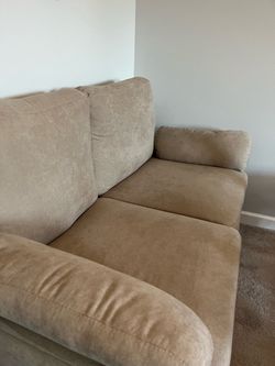 Beige/tan Loveseat with 2 side pockets