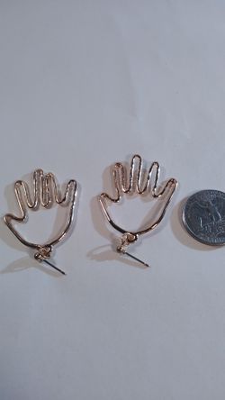Gold hand earrings