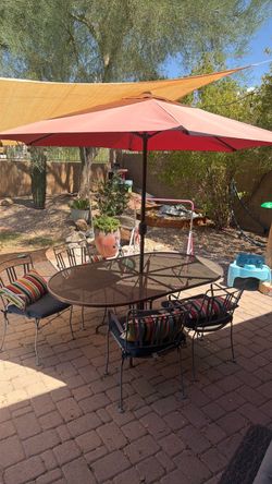 Big wrought iron table and 4 chairs