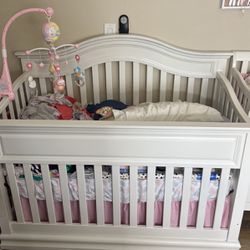 White Crib/Toddler Bed And White Changing Table.