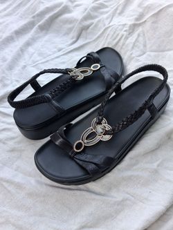 Never worn brand new w/o tags. Size 11/42 Allegria sandals