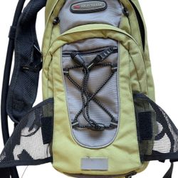 High Sierra hydration backpack Carries 2 liters Multiple pockets Helmet Holder Used