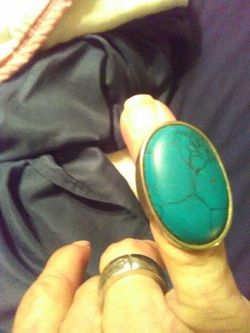 Turquoise and silver colored ring