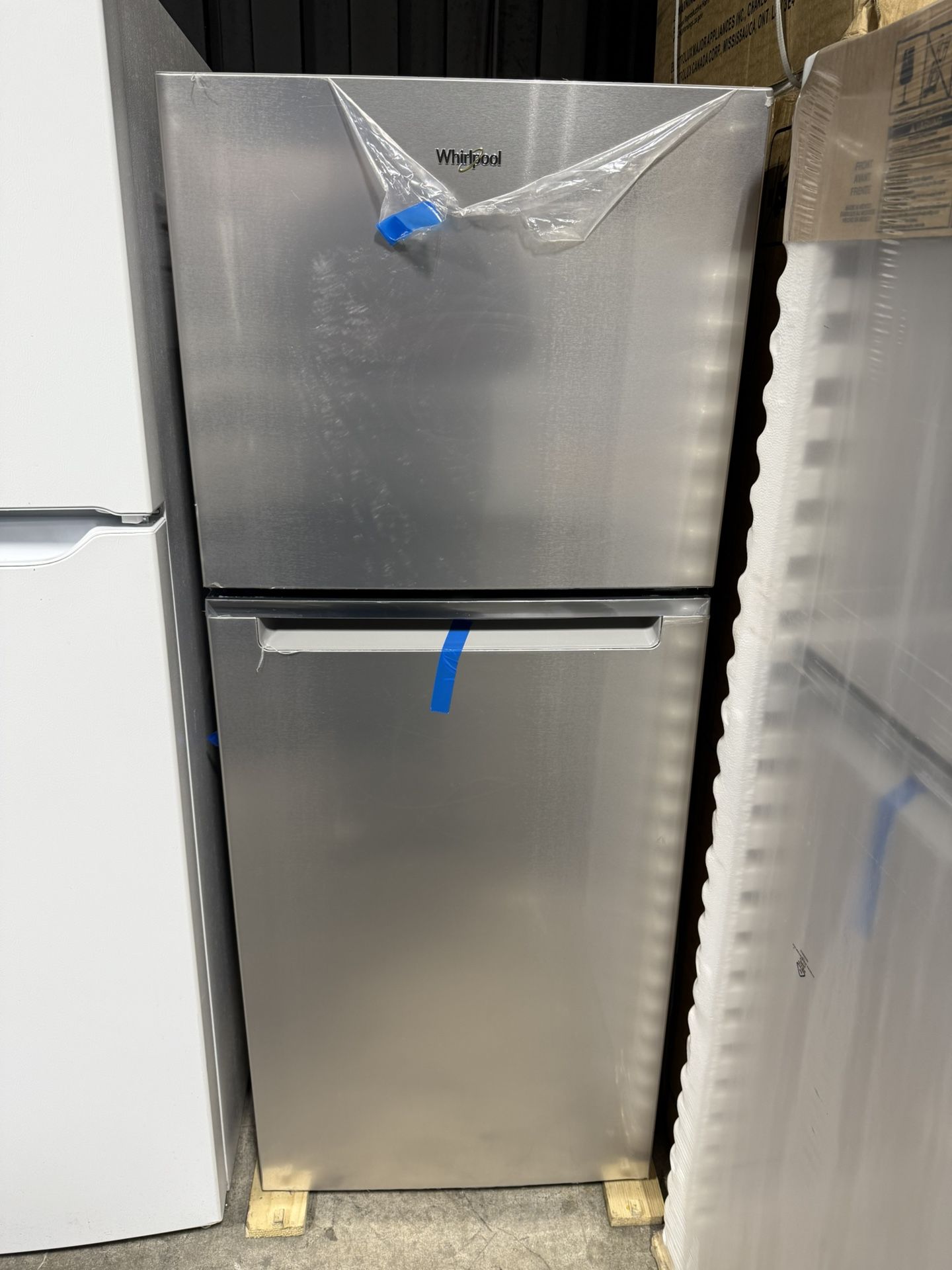 Brand new Whirlpool 24 in. 11.6 cu. ft. Top Freezer Refrigerator in Fingerprint Resistant Stainless Finish, Counter Depth