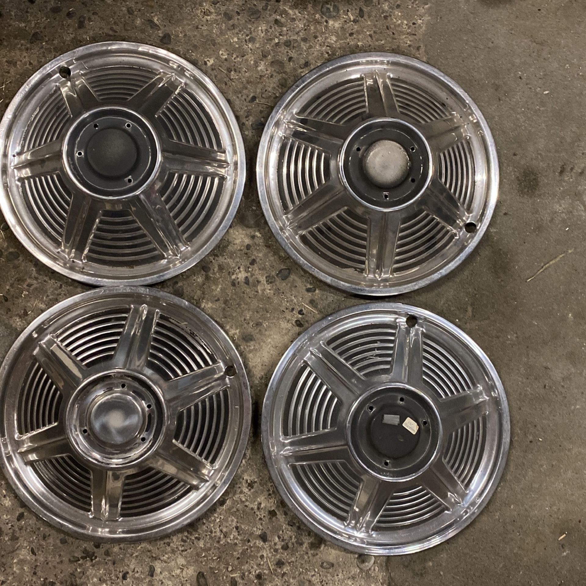 Ford mustang 1964 through 1966 factory hubcaps polished aluminum and black very good original condition missing center caps