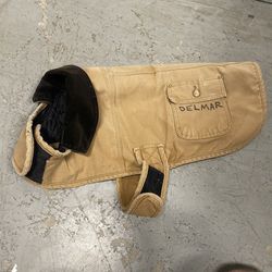 Khaki Tan CARHARTT Dog Chore Jacket Coat with Corduroy Collar, Pockets, and Black Lining.  Good pre-owned condition. DELMAR is written on the jacket. 
