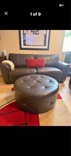Brown Leather Sofa/Sleeping bed and Matching Round Tufted Ottoman