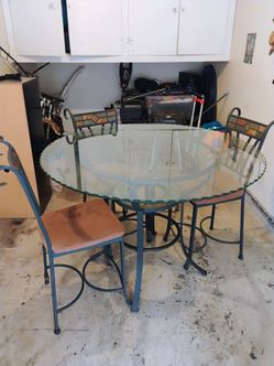 Extra large and thick round tall glass w/ Rott iron  stand dinning room table  w/ 4 chairs