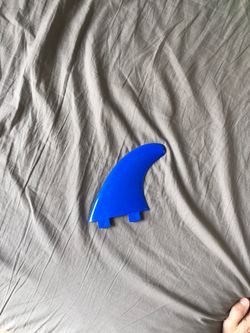 New blue fcs surfboard fin