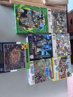 PUZZLES 7 boxes mint condition ALL 7 $25.00