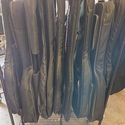 Assorted electric and acoustic guitar gig bags starting at