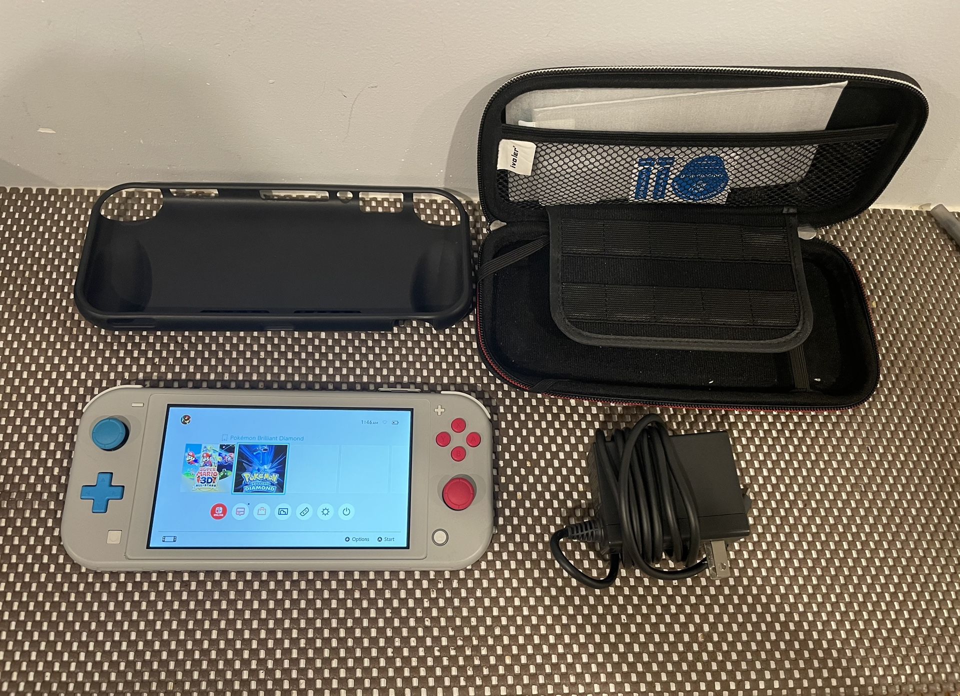 Nintendo Switch Lite Zacian and Zamazenta Edition in bundle W/2 cases, Charger And 2 Tempered Glass.