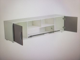 Expandable LOW PROFILE WITH  .FITS TV'S UP TO 75 INCH....ITEM IS ASSEMBLED Retails At 249.95. LIKE NEW. PLEASE READ BELOW