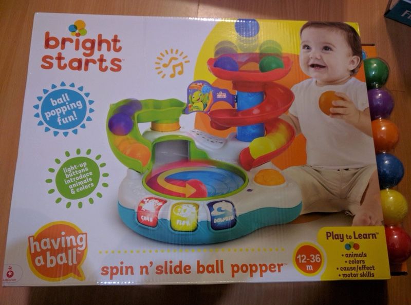 Spin and slide ball popper