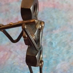 Scrap art figurine, musician playing a flute