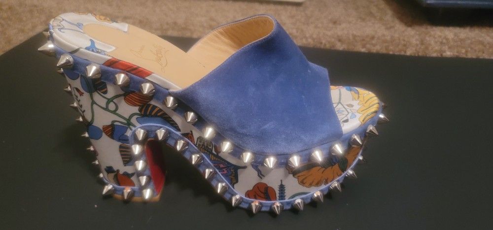 Christian Louboutin STUDDED RED BOTTOMS