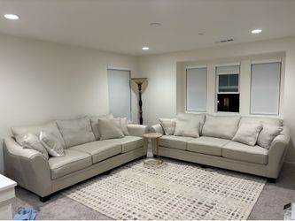 2 beige couches Ashley’s furniture