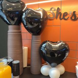 black heart-shaped balloons.