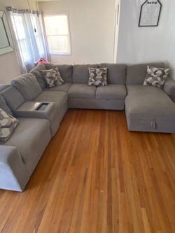 Sectional with compartment for storage