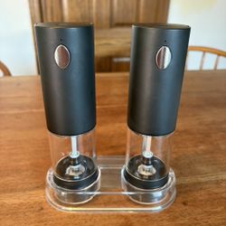 Battery run salt and pepper grinders.  Brand new, never used.