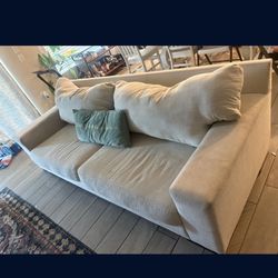 Two Cream Colored Couches 