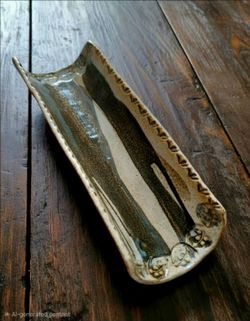 Vintage handmade art pottery footed ceramic drip glaze wine bottle rest 15" Long.