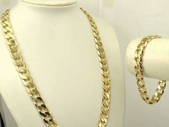 New 18 k yellow gold Cuban link chain and bracelet