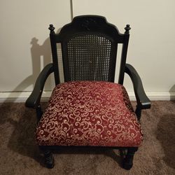 Low wooden chair with cushion