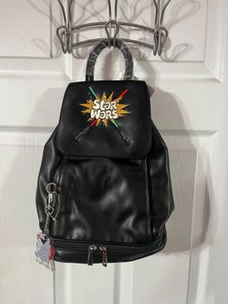 Disney Parks Star Wars Lightsaber Black Backpack Bag.  Brand new with tags.  The picture does not reflect how nice this bag is.  It’s also really soft