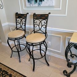 1 Set Of Swivel Counter Height Chairs 