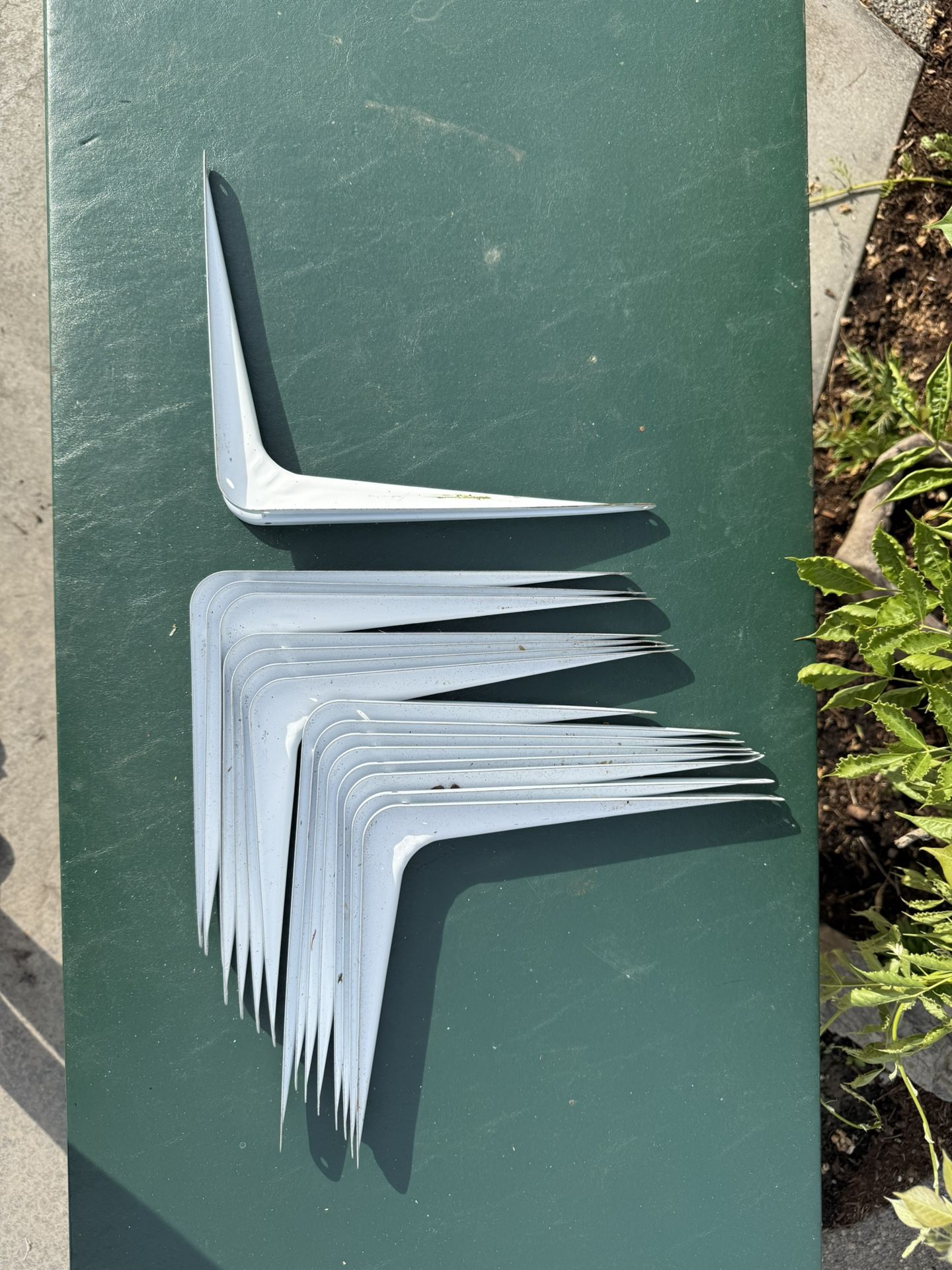 White metal shelf brackets