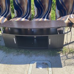 Dark brown curved TV stand