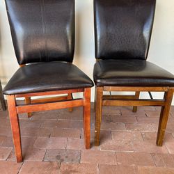2 Faux Leather And Wood Fold Up Chairs Folding