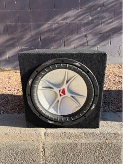 Kicker CompVR 12-inch car subwoofer in a carpeted enclosure