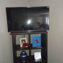 Sofa Bed  With Pillows Rug Coffee Table And Tv