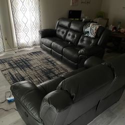 Gray Reclining Sofa and Loveseat Set