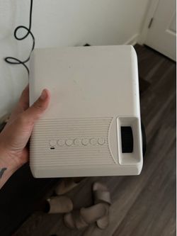 Model M19 LED projector. Remote and lens cover included