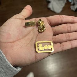 Silver One Sided Diamond Earring And 1 Sides Earrings With A Gold Bear For A Chain 