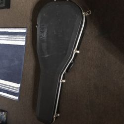 Hard Shell Guitar Case With Broken Guitar