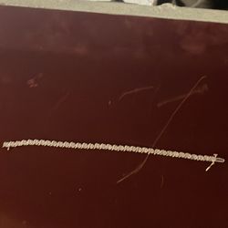 A car and a half, 14 carat gold tennis bracelet