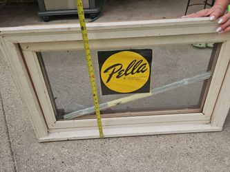 Pella wooden casement window with built in blinds