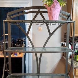 Ashley Furniture Pewter Green Glass Top Baker's Rack