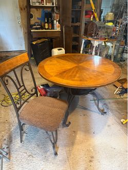 Round wooden table with 4 chairs