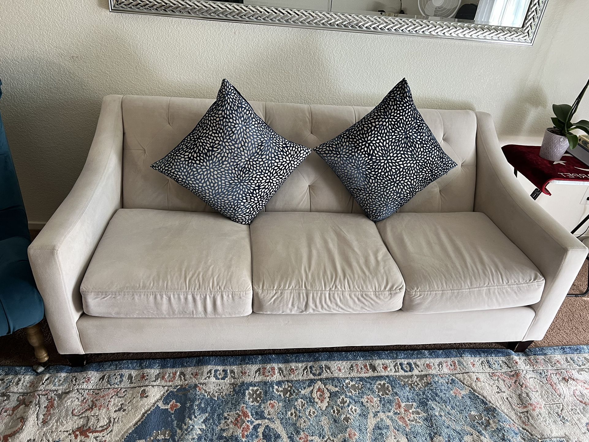 Couche And Accent Chair Along With Blue Pillows