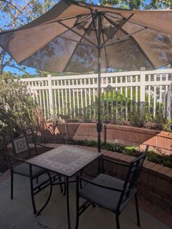 Bistro set with umbrella