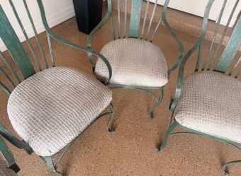 4 very heavy iron chairs