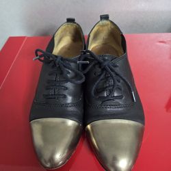 Coach black/gold shoes size 6