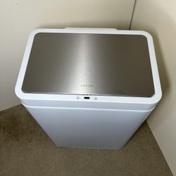 New Kohler 48L Motion, white Sensor Trash Can with a tiny dent on the left and right. See pictures.