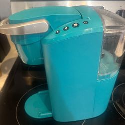 Teal Keurig single-serve coffee maker